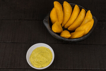 Delicious traditional Colombian empanadas with spicy sauce