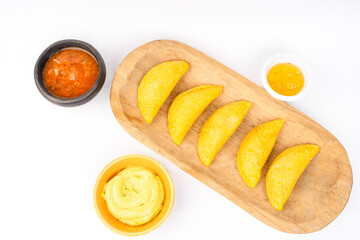 Colombian empanada with spicy sauce 