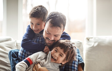 Funny, house and father with boys, family and laughing in living room for fun, happiness and...