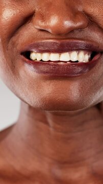 The African American pharmacist provides the woman with nicotine gum to help
