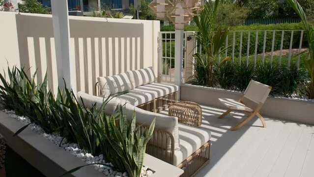 Sofa under a canopy in the backyard of a luxury villa in Dubai on a sunny day