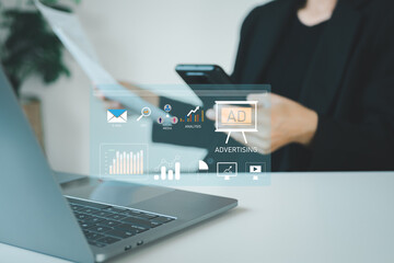 Digital marketing commerce online sale concept, Businesswoman use laptop with advertising on website. planning advertising marketing strategies to target social media native, ad, advertisers, sales.