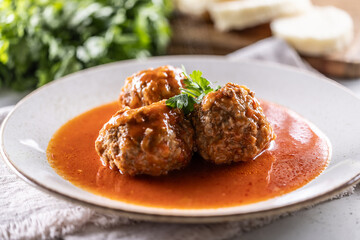 Traditional Italian meatballs with tomato sauce and parsley
