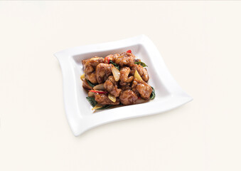 stir fried Chicken with onion, red chilli served in plate isolated on grey background side view of hong kong food