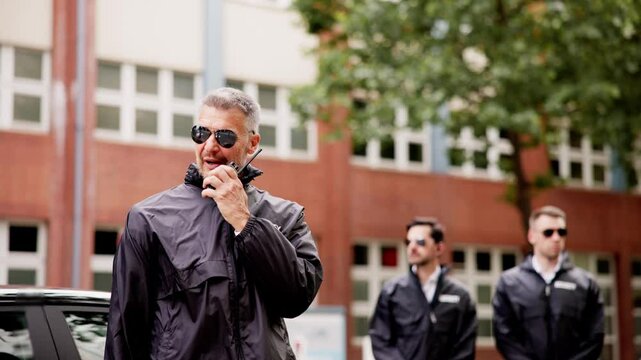 Luxury car business security guard providing VIP protection services, equipped
