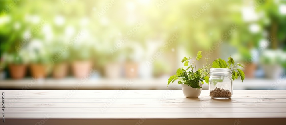 Poster blurred kitchen summer window background with a bleached wooden table top providing copy space image