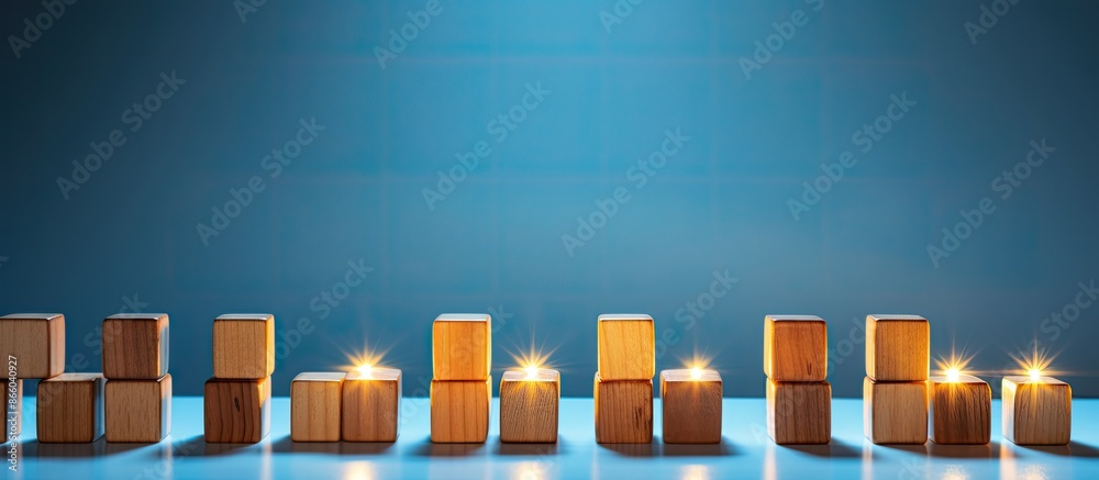 Poster a collection of glowing light bulbs on wooden cubes, with one bulb unlit, set against a blue backgro