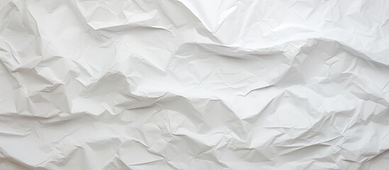 Obraz premium Background with a crumpled white paper texture providing copy space image.