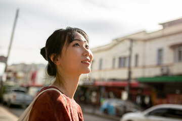 Young adult asian woman exploring the inner west urban streets of Sydney