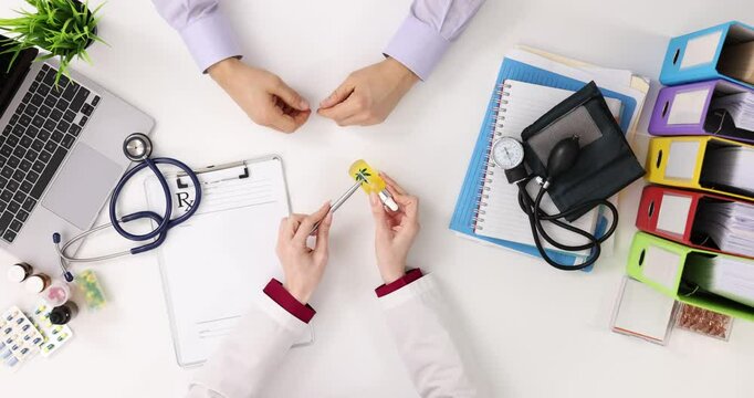 Doctor explains benefits of CBD products to treat insomnia to patient
