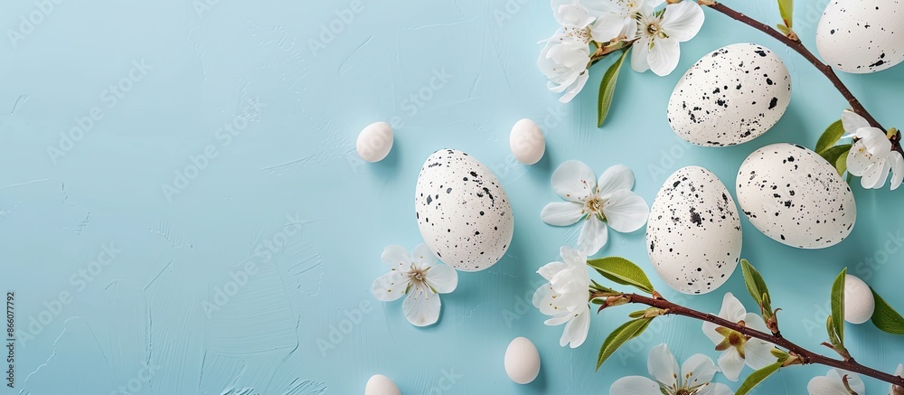 Aufkleber minimal easter concept featuring a composition of easter eggs and flower blossoms on a blue backgrou