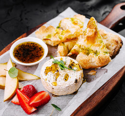 Gourmet baked brie with pear and strawberry
