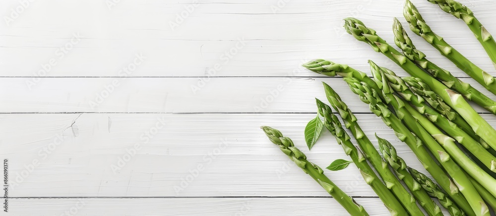 Aufkleber scandinavian-inspired top-down view mockup featuring fresh green asparagus on a white wooden table, 