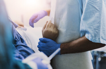 Patient, hands and doctor for surgery in hospital, healthcare and trust for operation in theater...