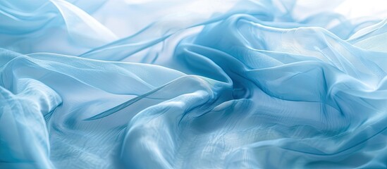Obraz premium Blurry light blue chiffon or silk fabric for text on a copy space image.