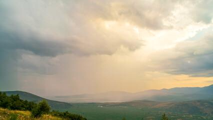 Delphi, Greece. Clouds with rain over the valley. Northern coast of the Gulf of Corinth, Itea Bay