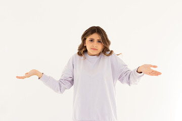 Confused thoughtful confused young woman holding copy space on palm over white background