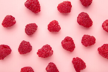 Sweet raspberry on pink background. Ripe berries