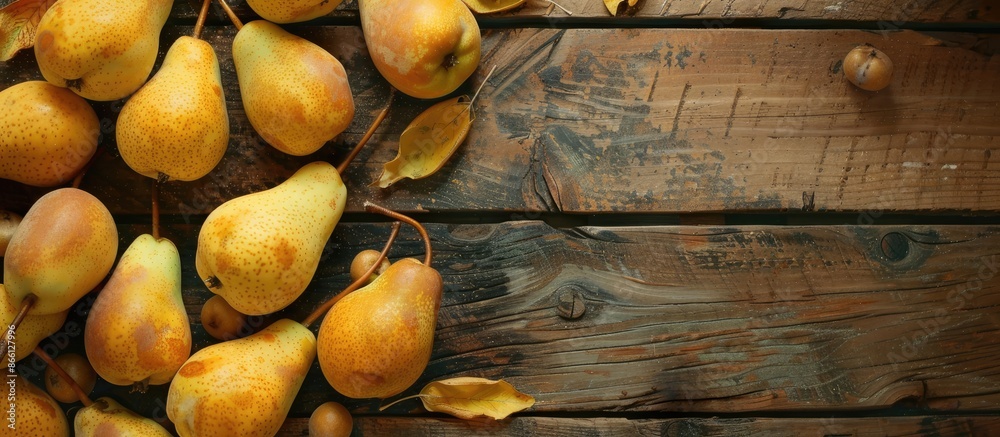 Poster autumnal scene with yellow pears arranged on a rustic wooden table, featuring copy space image.