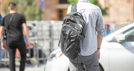 Tourist in a backpack in the city.