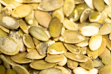 Peeled pumpkin seeds, kernels close-up