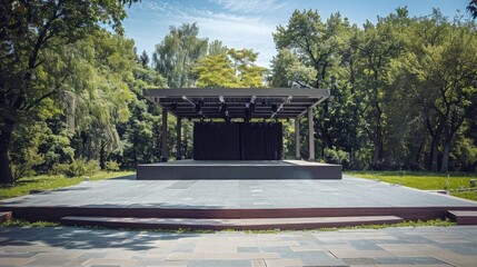 Description An empty outdoor stage set up for a dance performance on a sunny summer day
