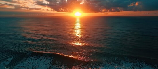 Obraz premium Sunset aerial view of the ocean, perfect for a copy space image.