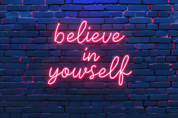 Neon sign with text believe in yourself on brick wall, motivational and inspirational quotes