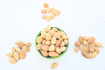 Almond with shell. It's other name Prunus amygdalus and Prunus dulcis. The almond is also the name of the edible and widely cultivated seed of this tree. indian almond.