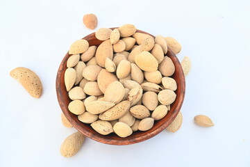 Almond with shell. It's other name Prunus amygdalus and Prunus dulcis. The almond is also the name of the edible and widely cultivated seed of this tree. indian almond.