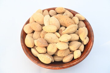 Almond with shell. It's other name Prunus amygdalus and Prunus dulcis. The almond is also the name of the edible and widely cultivated seed of this tree. indian almond.