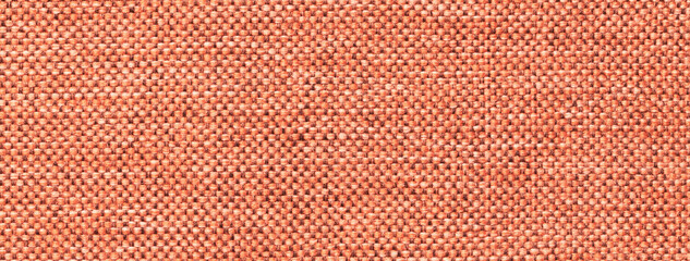 Obraz premium Texture of orange background from woven textile material with wicker pattern, macro. Vintage brick fabric