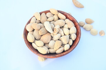 Almond with shell. It's other name Prunus amygdalus and Prunus dulcis. The almond is also the name of the edible and widely cultivated seed of this tree. indian almond.