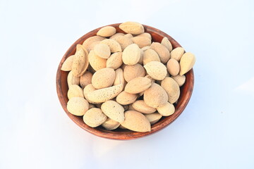 Almond with shell. It's other name Prunus amygdalus and Prunus dulcis. The almond is also the name of the edible and widely cultivated seed of this tree. indian almond.