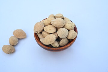 Almond with shell. It's other name Prunus amygdalus and Prunus dulcis. The almond is also the name of the edible and widely cultivated seed of this tree. indian almond.