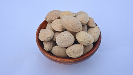 Almond with shell. It's other name Prunus amygdalus and Prunus dulcis. The almond is also the name of the edible and widely cultivated seed of this tree. indian almond.