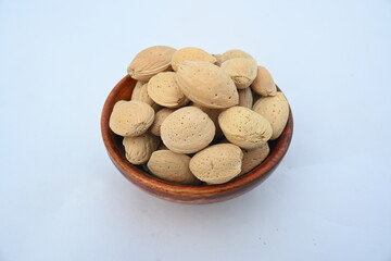 Almond with shell. It's other name Prunus amygdalus and Prunus dulcis. The almond is also the name of the edible and widely cultivated seed of this tree. indian almond.