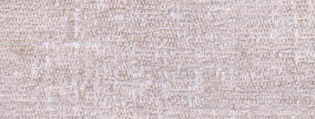 Texture fluffy woolen beige textile background from soft fleecy material, macro. Cream fabric with pattern