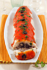 White beans roll with black sausage.