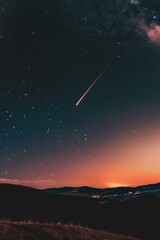 Fototapeta premium A single meteor in a clear night sky, symbolizing sudden flashes of inspiration and ideas. 