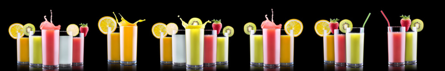 Delicious Fruit Smoothies in glass with splash isolated on a black background