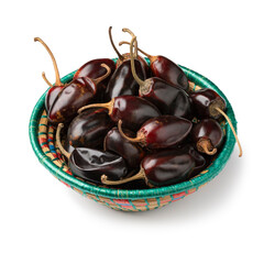 Basket with dried Chile Catarina, Catarina peppers isolated on white background close up