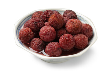 White bowl with Arbutus berries in syrup close up isolated on white background