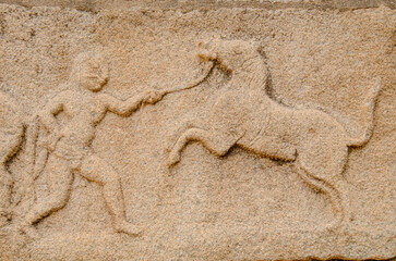 Mural sculpture on stone at Royal Enclosure. Base of Mahanavami Dibba or the Dussehra Platform. Hampi, Karnataka, India, Asia. 