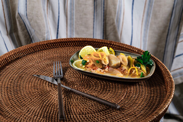 braised leeks cooked in olive oil cold starter appetizer zeytinyagli pirasa served on wicker tray