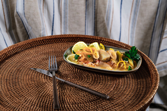 braised leeks cooked in olive oil cold starter appetizer zeytinyagli pirasa served on wicker tray