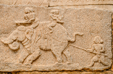 Mural sculpture on stone at Royal Enclosure. Base of Mahanavami Dibba or the Dussehra Platform. Hampi, Karnataka, India, Asia. 