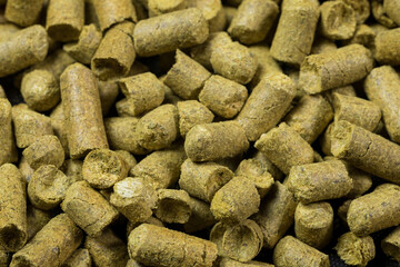 Close up granulated hops. Ingredient for Industrial production of beer.