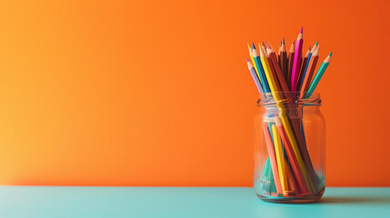 A colorful minimalist jar filled with colored pencils, placed in the bottom right corner of an orange background, providing space for text on the top left.