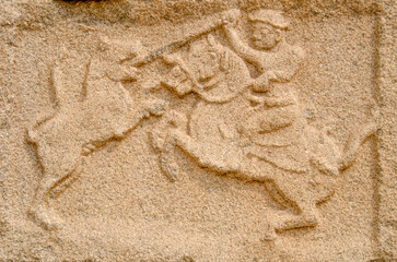 Mural sculpture on stone at Royal Enclosure. Base of Mahanavami Dibba or the Dussehra Platform. Hampi, Karnataka, India, Asia. 